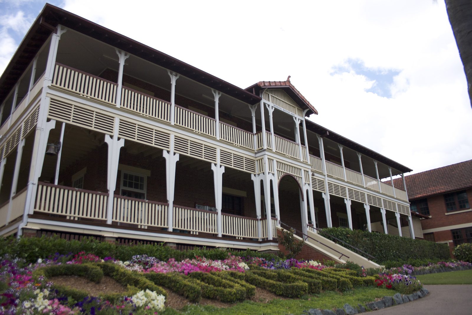 School House at Churchie in East Brisbane, a two-storey timber building with verandahs
