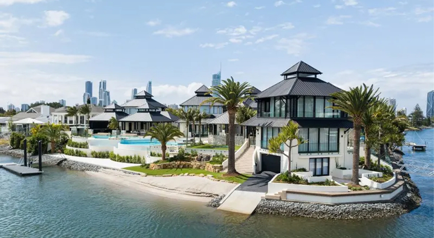 Waterfront prestige homes on the Gold Coast with the Surfers Paradise skyline behind